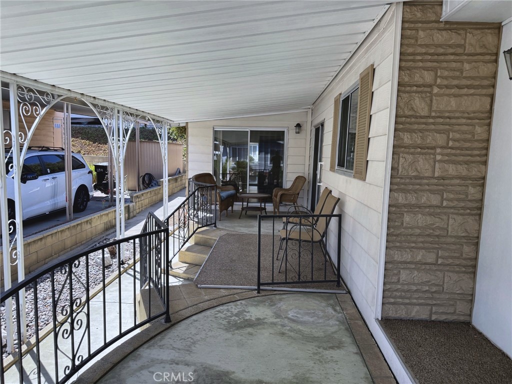 Covered outdoor patio and seating area - 2851 Rolling Hills 187, Fullerton CA 92835 - photo 13