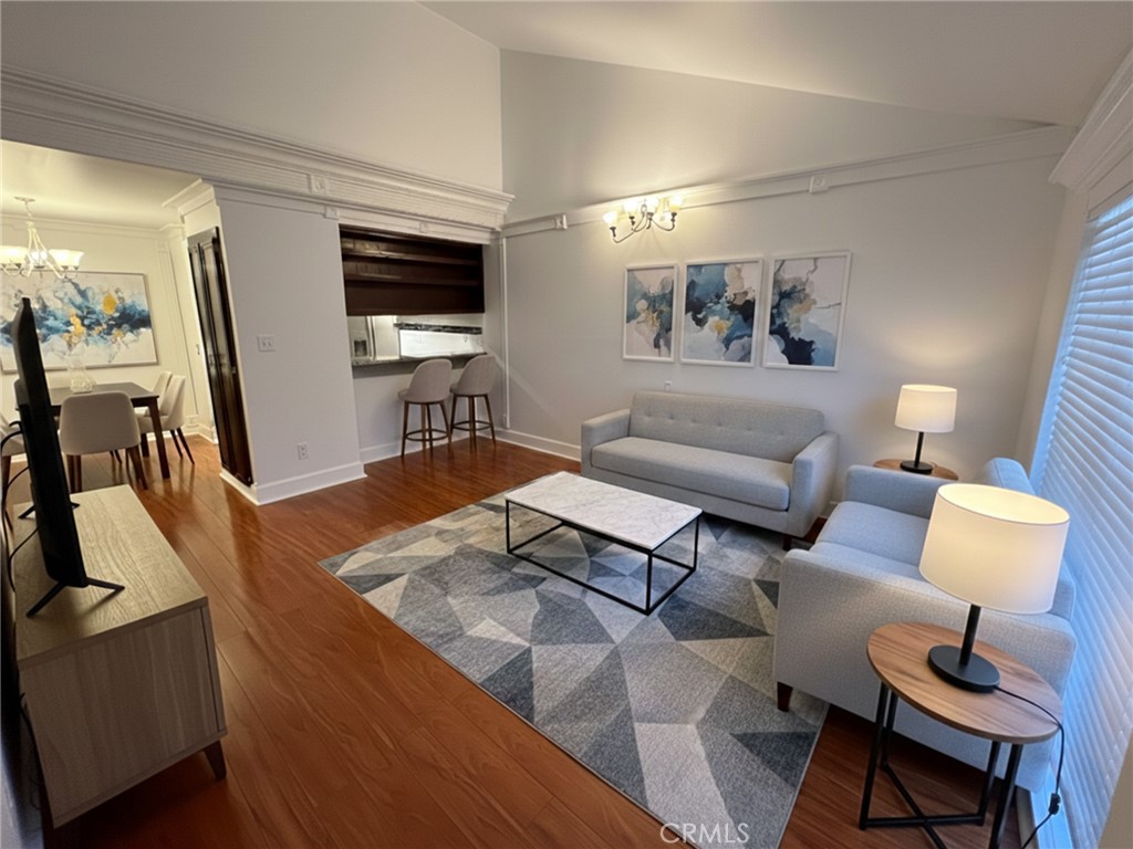 VIRTUALLY STAGED Living Room - 3010 Associated 130, Fullerton CA 92835 - photo 1