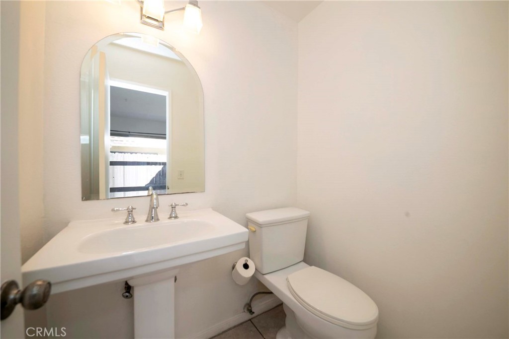 Half Bath on 1st Floor - 3733 N Harbor 53, Fullerton CA 92835 - photo 9