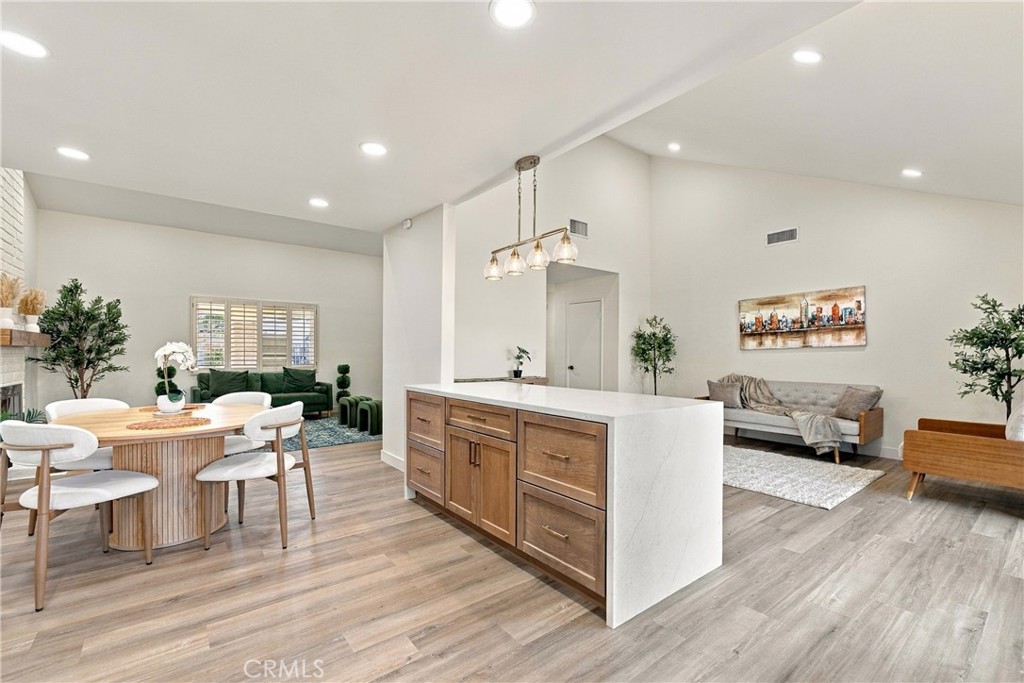 View from Kitchen into Family, Dining and Living rooms. - 3907 Madonna, Fullerton CA 92835 - photo 10