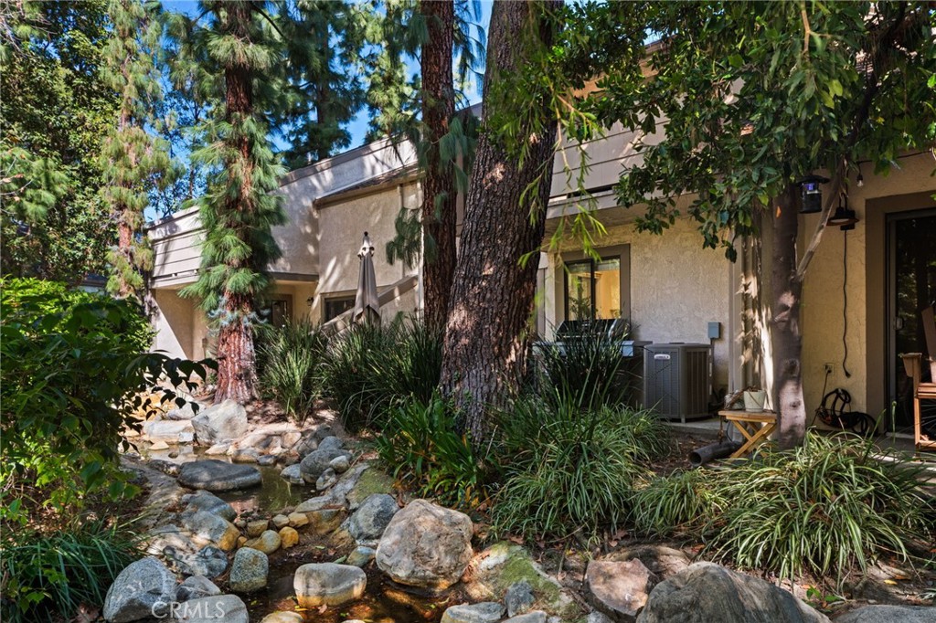View of Back Patio through the Stream - 512 Quiet Brook Circle 188, Fullerton CA 92831 - photo 29