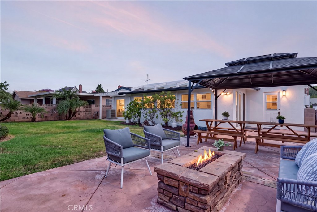 Digital fire, interior lights, and evening sky added - 527 N Lincoln Avenue, Fullerton CA 92831 - photo 33