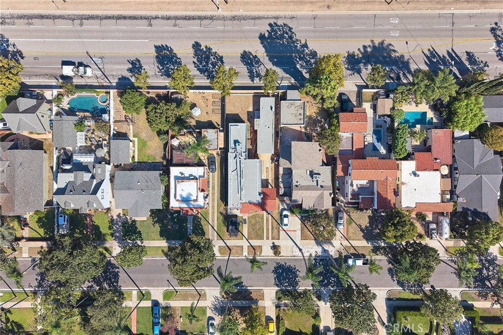 The structures showcase modern, flat-roofed styling with matching terracotta or peach-colored stucco exteriors and minim - 529 W Whiting, Fullerton CA 92832 - photo 36