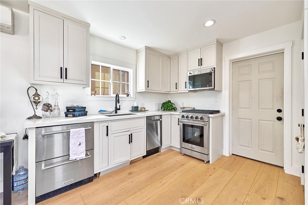 Kitchenette and door to garage - 529 W Whiting, Fullerton CA 92832 - photo 29