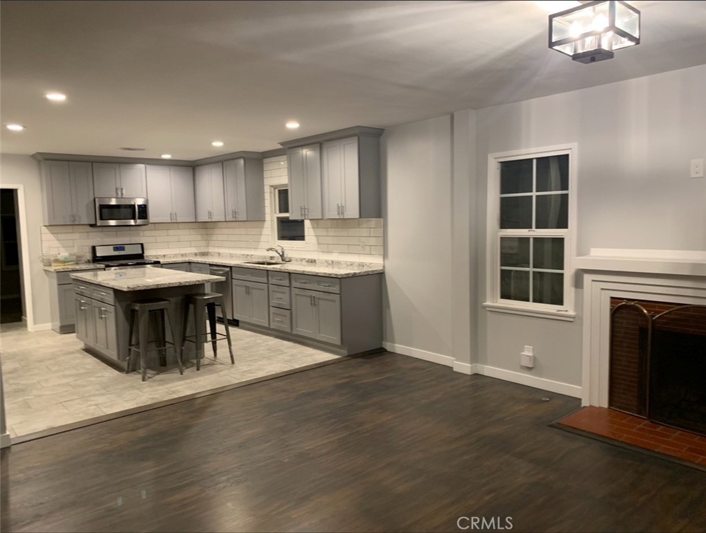 Remodeled Kitchen opens into Family Room. - 608 Drake, Fullerton CA 92832 - photo 2