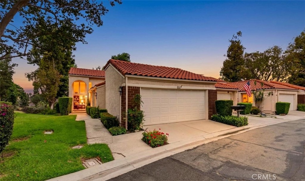Photo digitally enhanced to twilight for marketing purposes. - 636 Colonial Circle, Fullerton CA 92835 - photo 1