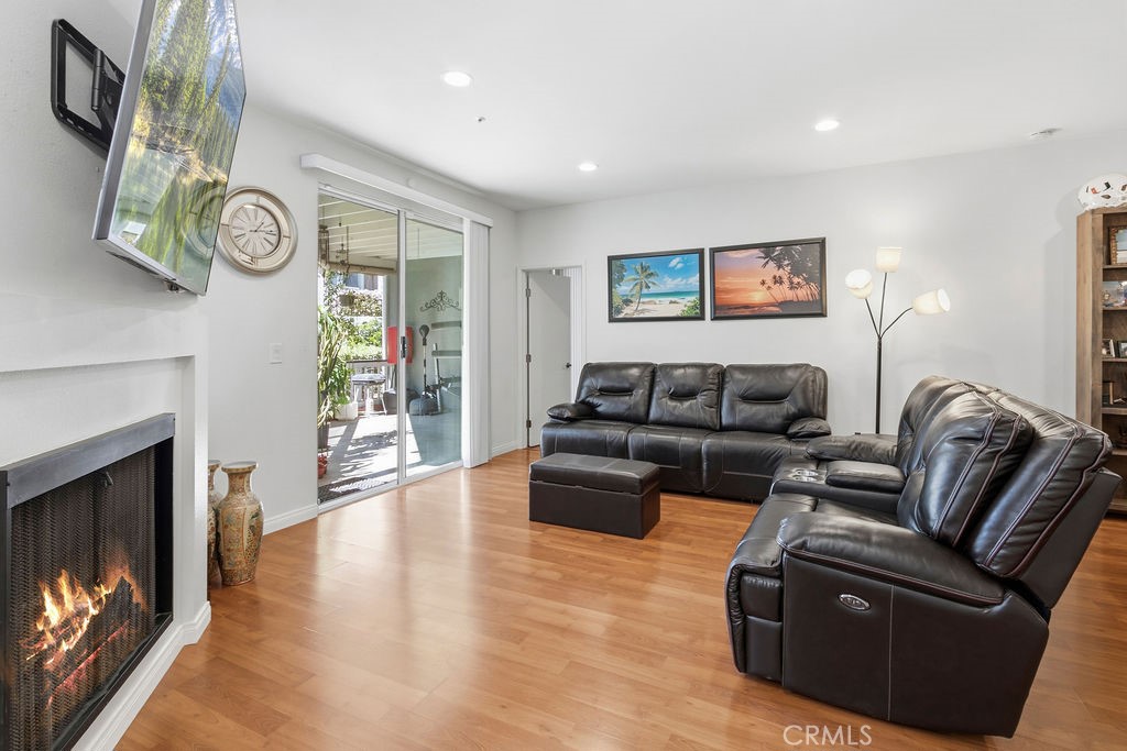 light and bright living room with fireplace - 10361 Garden Grove Blvd 12, Garden Grove CA 92843 - photo 4