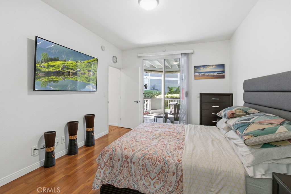 Primary bedroom with private patio slider - 10361 Garden Grove Blvd 12, Garden Grove CA 92843 - photo 11