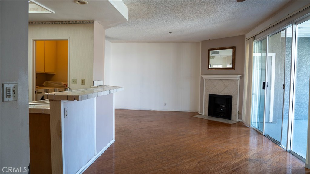 Living room + Kitchen - 10371 Garden Grove Blvd 8, Garden Grove CA 92843 - photo 16