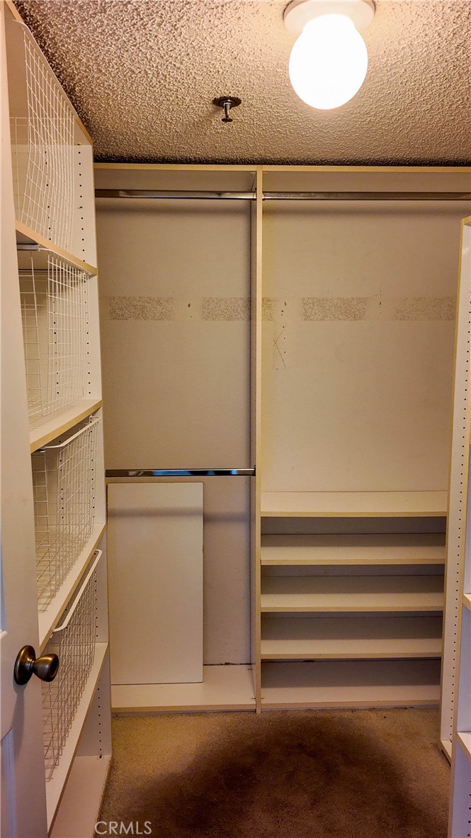 Primary Suite Walk-in closet - 10371 Garden Grove Blvd 8, Garden Grove CA 92843 - photo 24