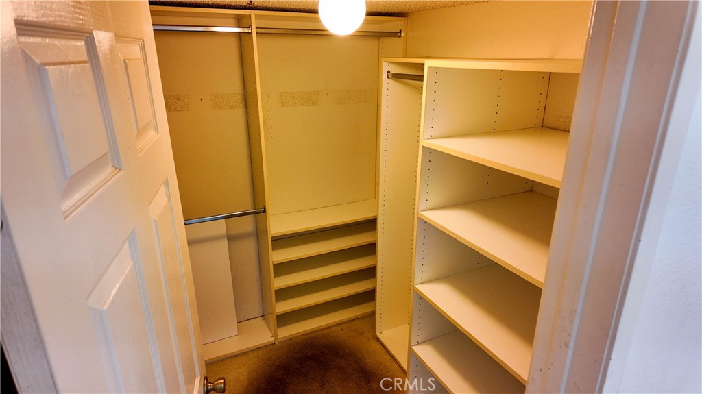 Primary Suite walk-in closet - 10371 Garden Grove Blvd 8, Garden Grove CA 92843 - photo 25