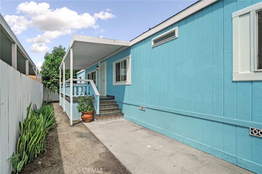 Left side Deck and patio cover - 11301 Euclid 76, Garden Grove CA 92840 - photo 3