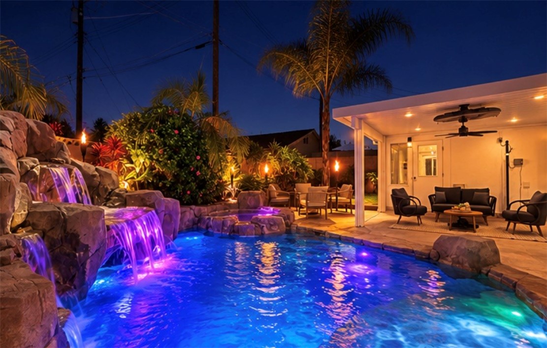 Beautiful Tropical Pool with waterfall and colored lights. AI-Enhanced Twilight Photo - 11782 Jasper Street, Garden Grove CA 92845 - photo 42