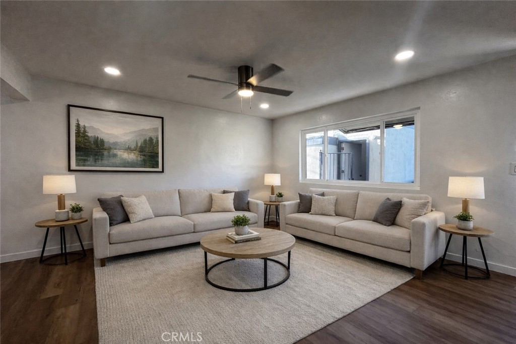Spacious living room. Artificially staged - 11861 Bailey Street D, Garden Grove CA 92845 - photo 1