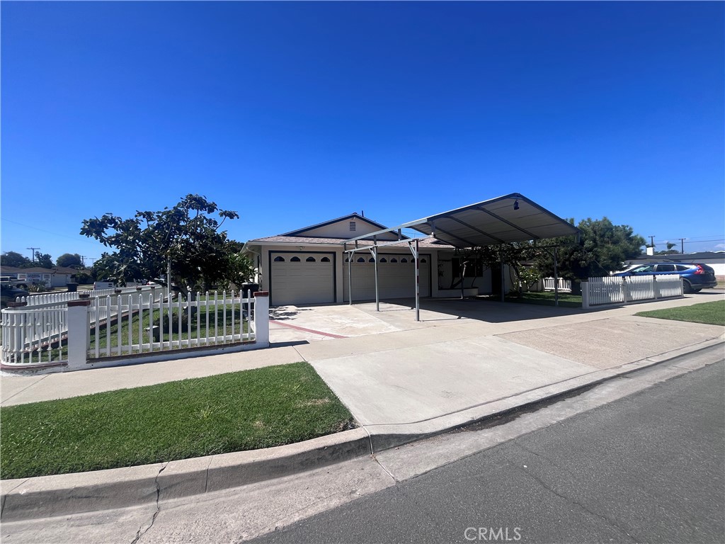 3 car garage and covered Carport - 12581 Cardinal Avenue, Garden Grove CA 92843 - photo 2