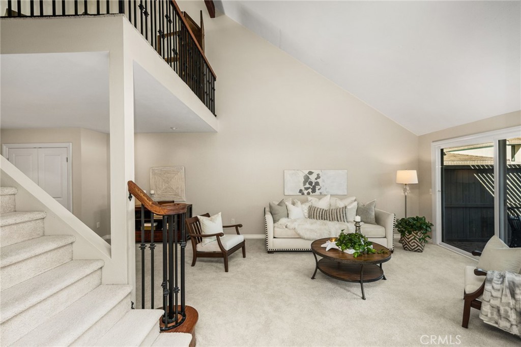 Vaulted ceilings and an open layout create a wonderful sense of space throughout the living room. - 12632 Romaine Wy, Garden Grove CA 92845 - photo 7