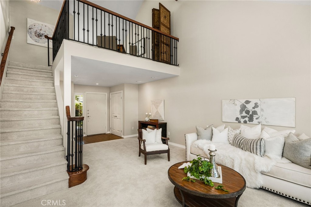 A central staircase anchors the thoughtful floor plan, connecting the main living areas to the second level. - 12632 Romaine Wy, Garden Grove CA 92845 - photo 9