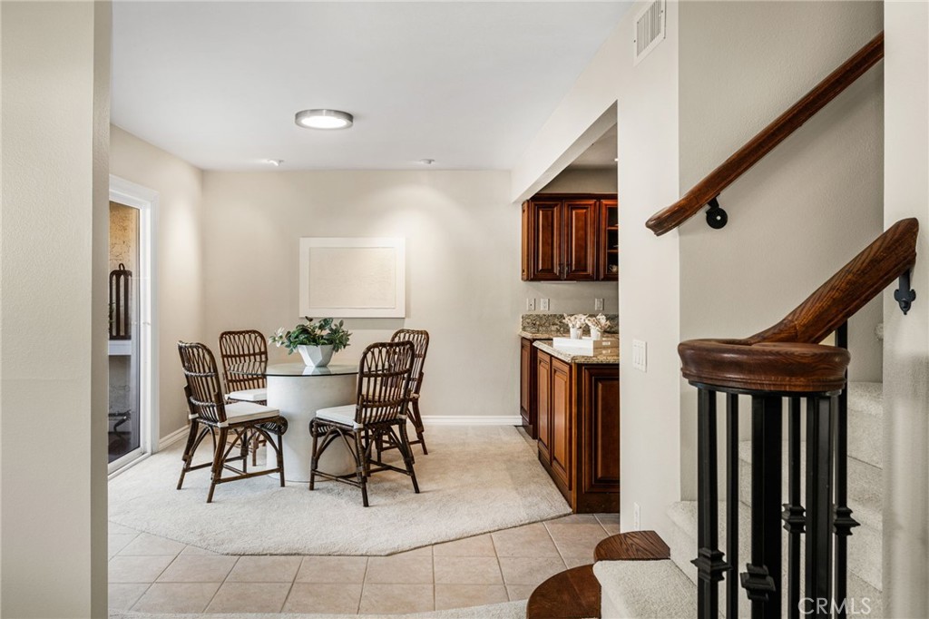 An open, airy design connects the living room, entry and kitchen beautifully. - 12632 Romaine Wy, Garden Grove CA 92845 - photo 11