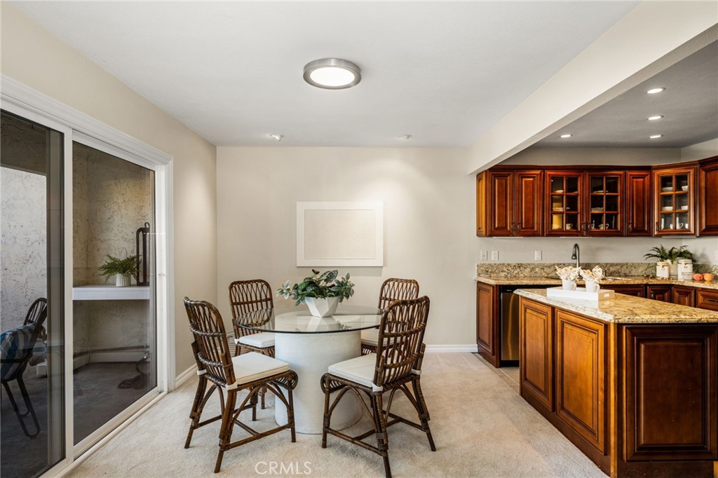 A welcoming dining area sits beside the kitchen, perfect for everyday meals or gathering with friends. - 12632 Romaine Wy, Garden Grove CA 92845 - photo 12