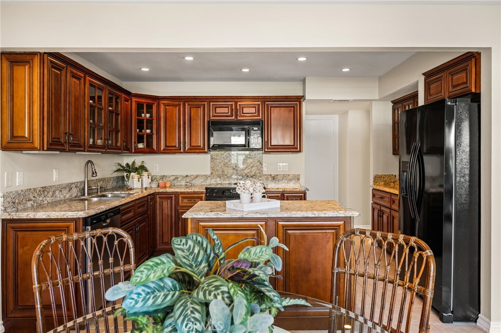 A chef’s delight with generous counter space, abundant cabinet storage and a refrigerator included as an extra bonus. - 12632 Romaine Wy, Garden Grove CA 92845 - photo 15