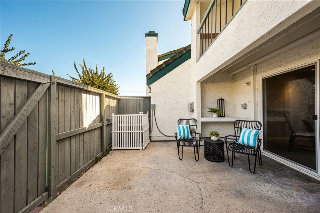 Enclosed rear patio offers a welcoming spot for morning coffee, outdoor dining or relaxing - 12632 Romaine Wy, Garden Grove CA 92845 - photo 23