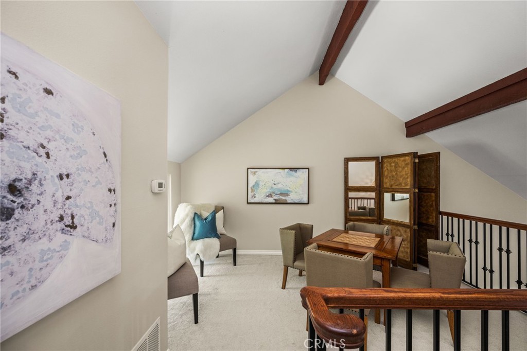 Open upstairs loft, formerly used as randaughters bedroom, currently used as an office, features vaulted ceilings and ex - 12632 Romaine Wy, Garden Grove CA 92845 - photo 29