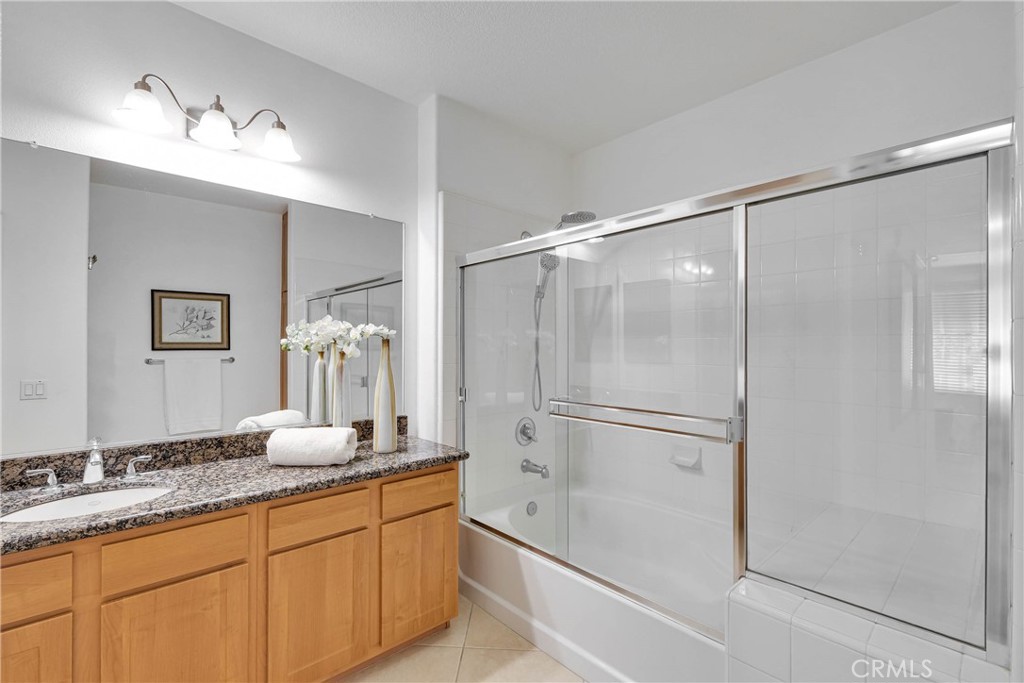 Primary bathroom with full sliding glass enclosure - 12664 Chapman Avenue 1402, Garden Grove CA 92840 - photo 16