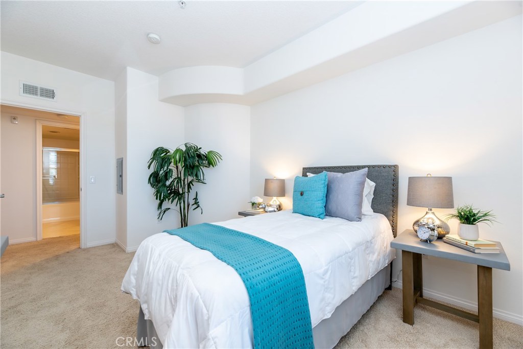 Previous staged photo of the hallway bedroom (2nd) - 12664 Chapman Avenue 1402, Garden Grove CA 92840 - photo 23