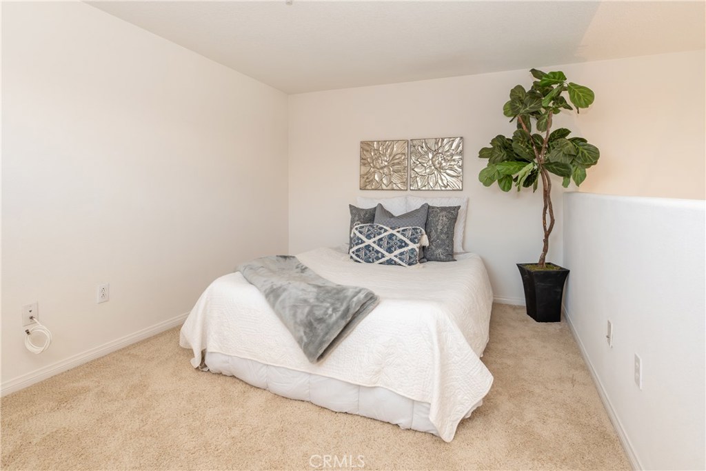 Loft area offers flexibility whether occasional guest bedroom accommodation, a study, home office, hobby or craft room - 12664 Chapman Avenue 1402, Garden Grove CA 92840 - photo 27