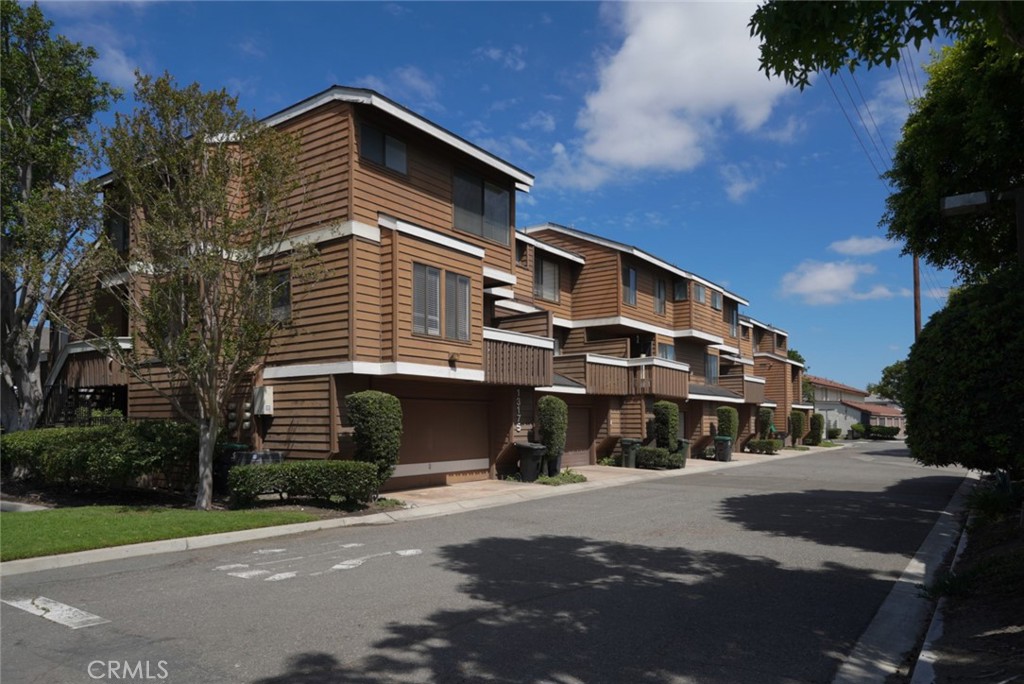 SIDE - REAR ELEVATION. THE COVETED CORNER END UNIT. - 13175 Creek View Drive F, Garden Grove CA 92844 - photo 1