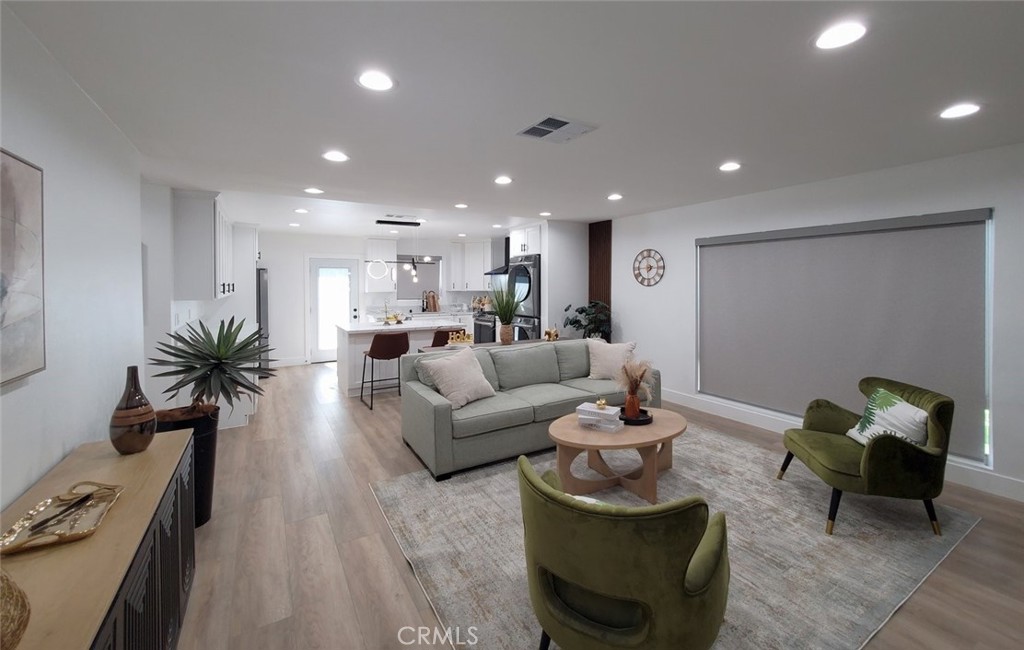 Main house- living room & kitchen area - 13392 Laramore, Garden Grove CA 92843 - photo 8