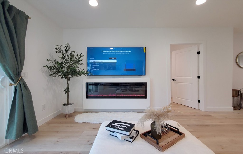 Detached ADU FONDREN- Living room with TV & fireplace - 13392 Laramore, Garden Grove CA 92843 - photo 31