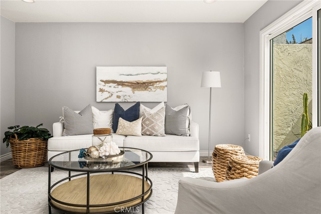 A welcoming living room offers comfortable space to relax, gather, and entertain. - 6931 Danvers Dr, Garden Grove CA 92845 - photo 6