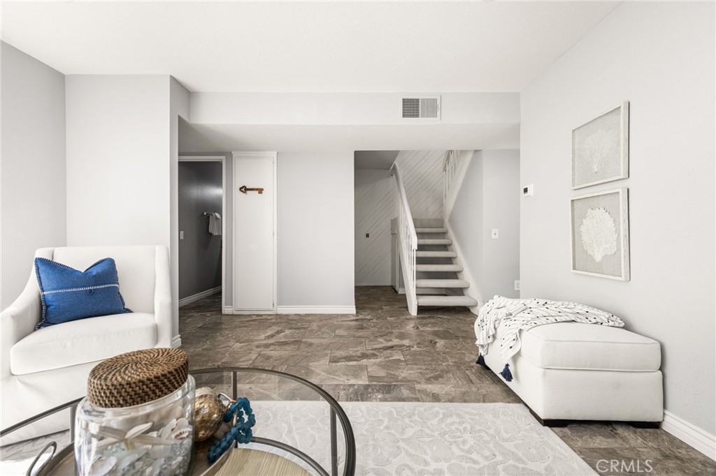 The generous living room layout offers flexible space for additional seating or a reading nook. - 6931 Danvers Dr, Garden Grove CA 92845 - photo 9