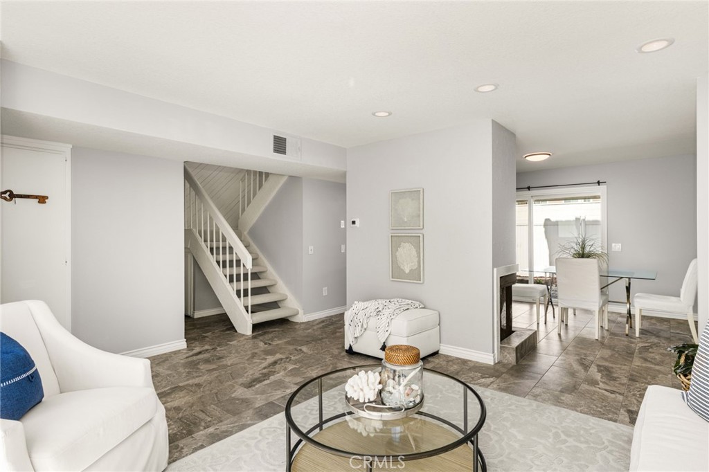 A flowing layout creates comfortable spaces for everyday living and entertaining. - 6931 Danvers Dr, Garden Grove CA 92845 - photo 12