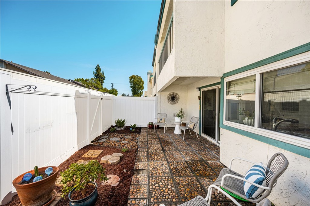 Patio Relax beneath the covered seating area and enjoy this charming outdoor retreat—perfect for morning coffee or gathe - 6931 Danvers Dr, Garden Grove CA 92845 - photo 27