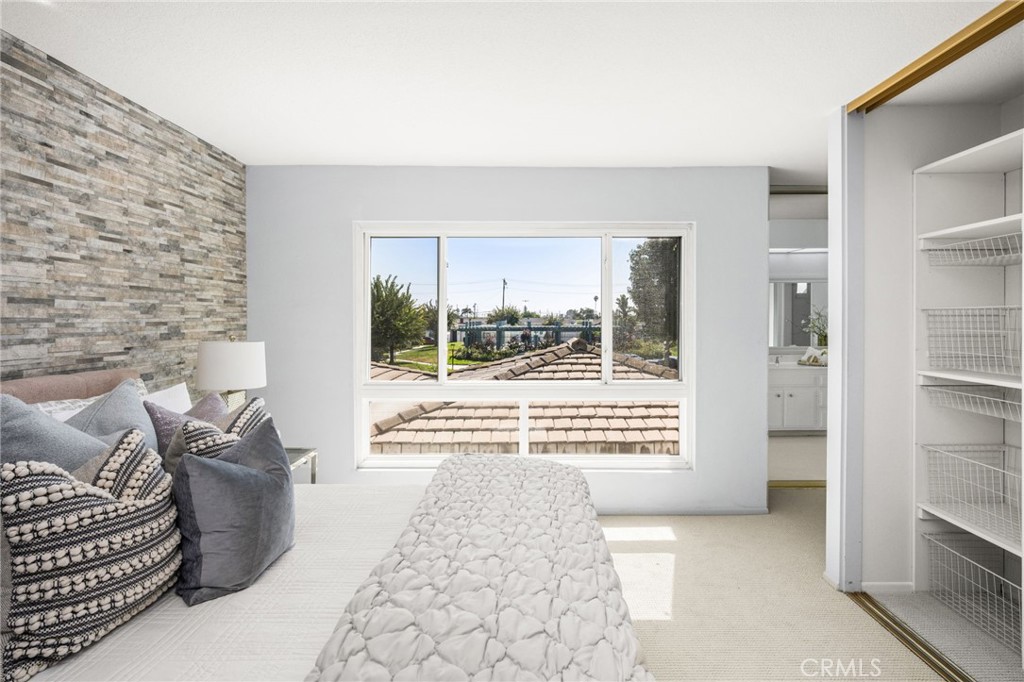 Carpeted stairs lead to the second level, accented by crisp white paneling. - 6931 Danvers Dr, Garden Grove CA 92845 - photo 34