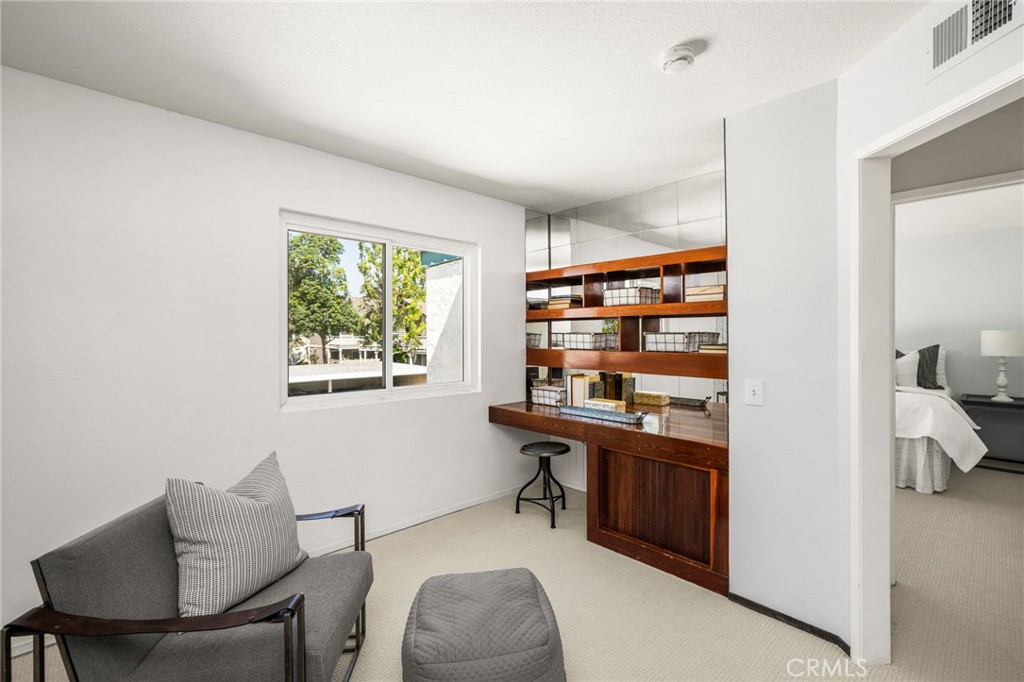 Third bedroom / office Versatile open loft currently used as an office, with natural light and space for a potential thi - 6931 Danvers Dr, Garden Grove CA 92845 - photo 43