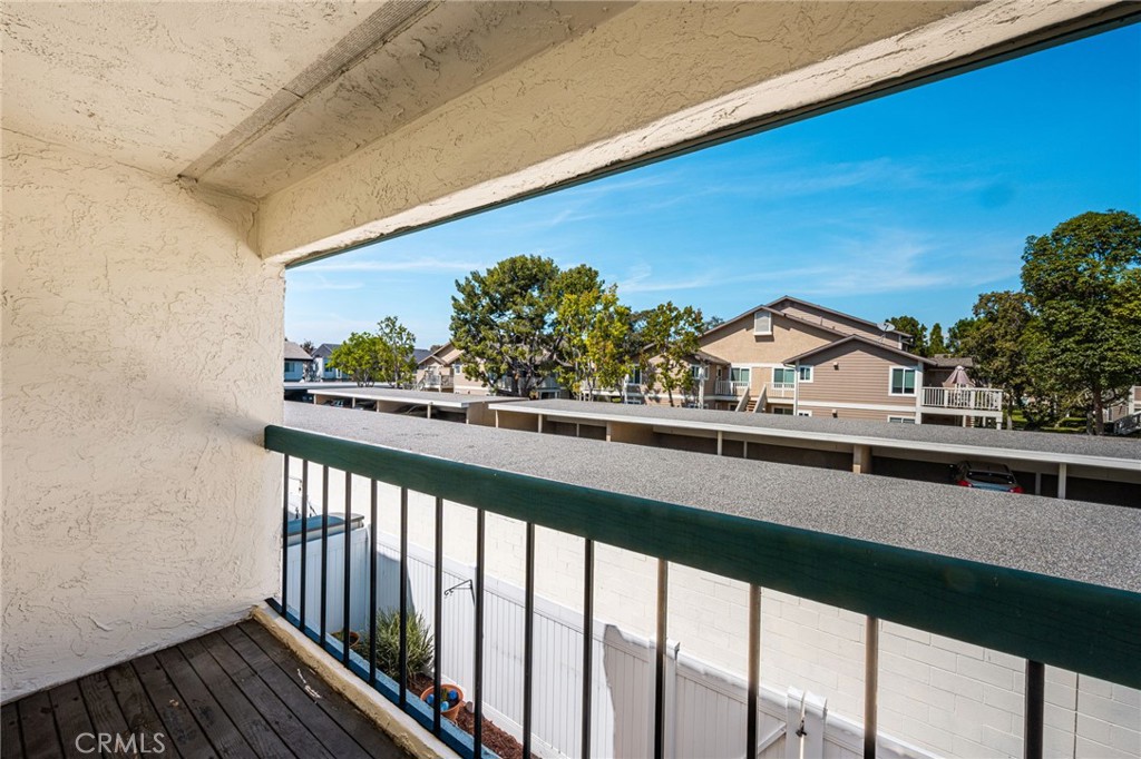 Guest balcony Covered balcony off the guest bedroom offers a pleasant spot to enjoy fresh air and neighborhood views. - 6931 Danvers Dr, Garden Grove CA 92845 - photo 50