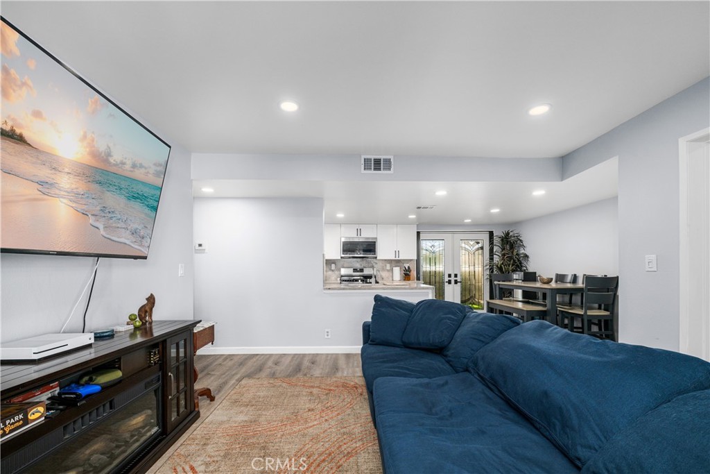 living room, on right is eating area - 6971 Knollcrest #48 48, Garden Grove CA 92845 - photo 13