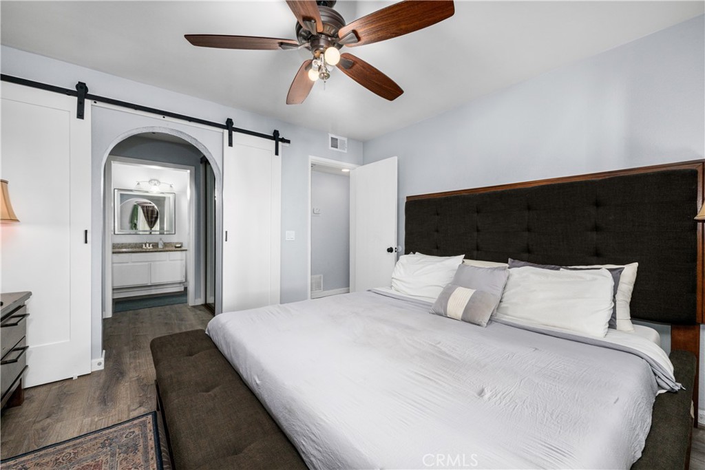 bedroom with barn door into closets & bathroom - 6971 Knollcrest #48 48, Garden Grove CA 92845 - photo 39