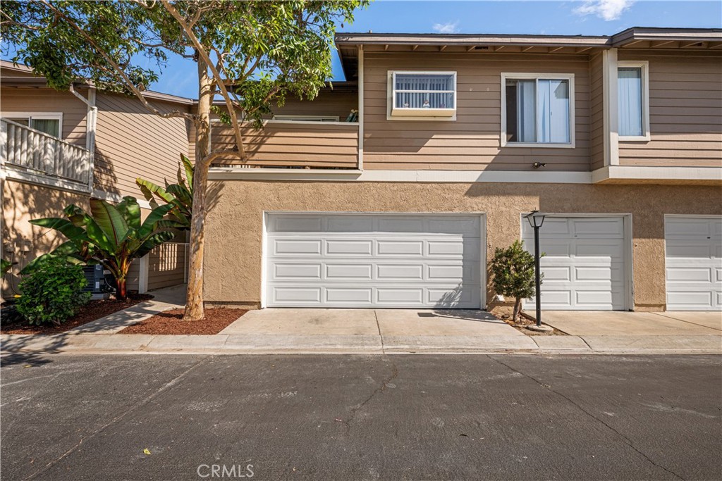Garage door in back, lush plants, some could be moved to back patio - 6971 Knollcrest #48 48, Garden Grove CA 92845 - photo 55