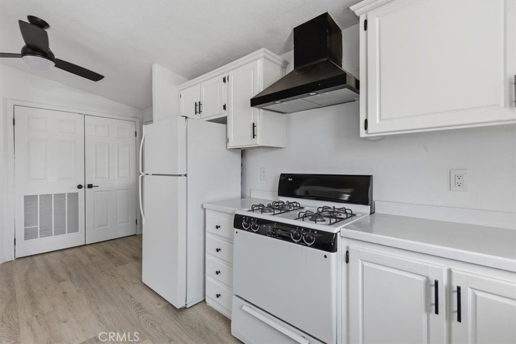 Kitchen with white cabinetry - 7887 Lampson Ave Avenue 10, Garden Grove CA 92841 - photo 6