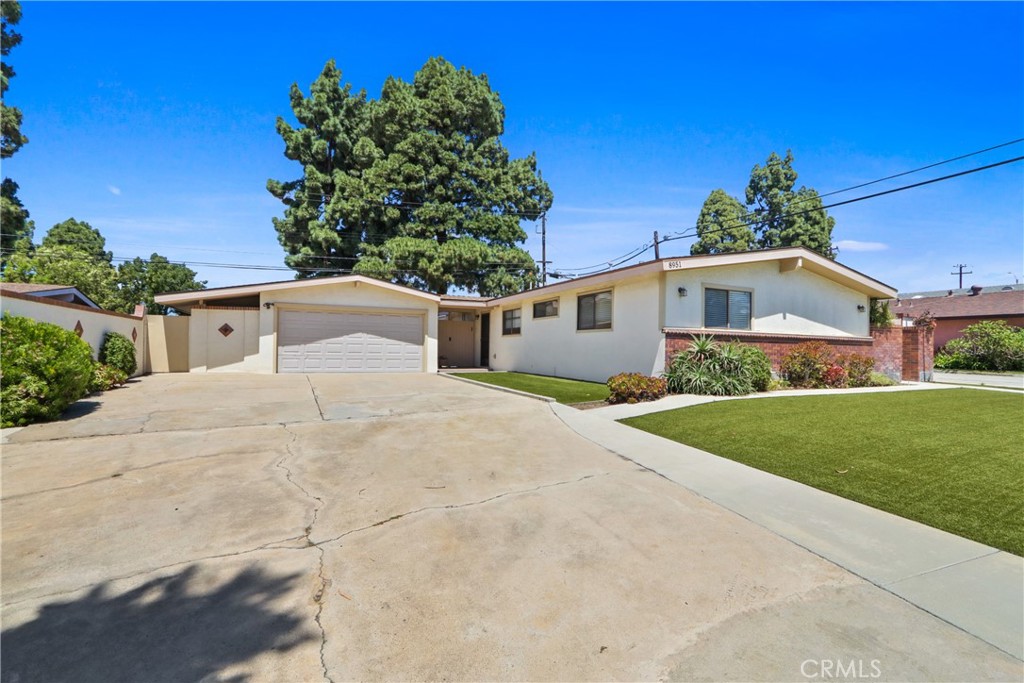 Oversized driveway offers ample parking for up to four vehicles or even an RV - 8951 Blossom, Garden Grove CA 92841 - photo 1