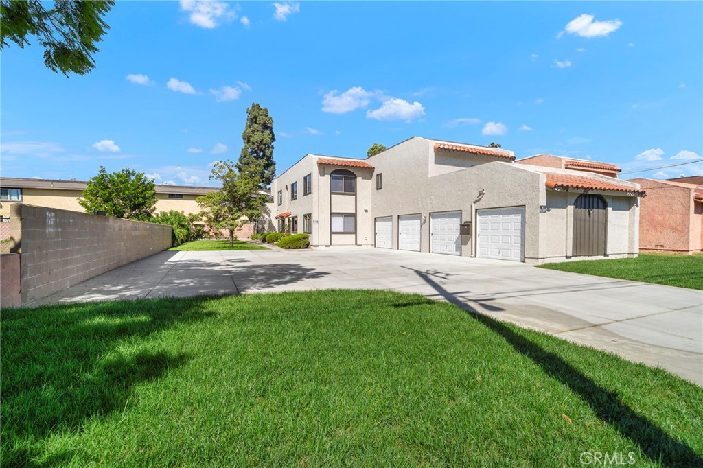 Mature landscaping and open lawn areas create an attractive setting for this well-maintained fourplex. - 9941 11th Street, Garden Grove CA 92844 - photo 4