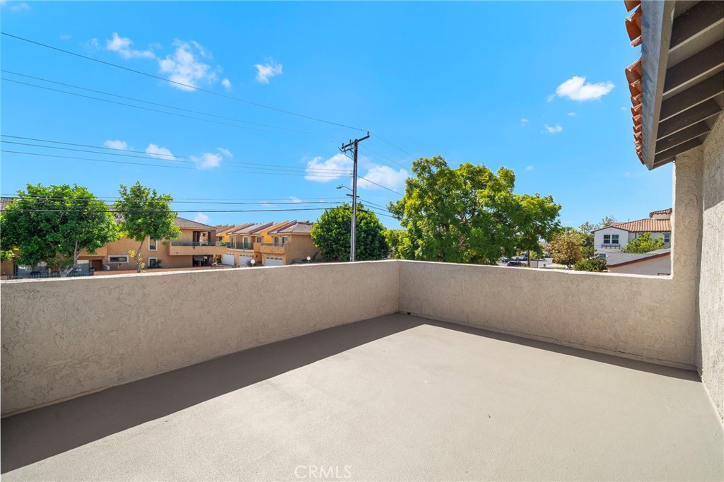 The expansive private balcony offers an open-air retreat with newly waterproofed surfaces and surrounding neighborhood v - 9941 11th Street, Garden Grove CA 92844 - photo 29