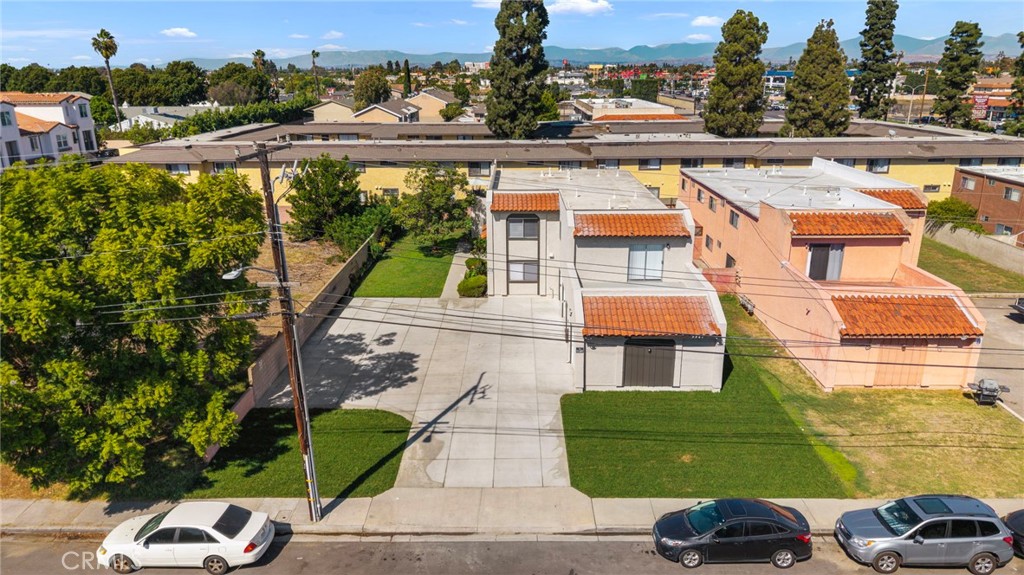 This aerial perspective places the fourplex within its established Garden Grove neighborhood and highlights its broad fr - 9941 11th Street, Garden Grove CA 92844 - photo 33