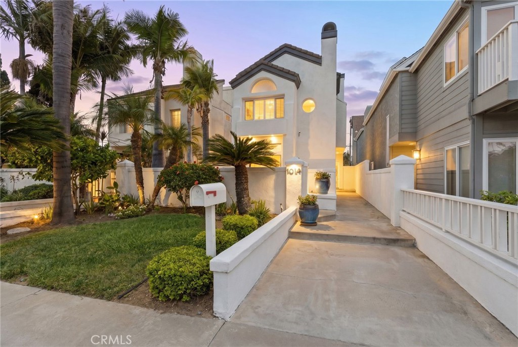 Elegant twilight curb appeal highlighting the home’s exterior presence - 1014 England Street, Huntington Beach CA 92648 - photo 1