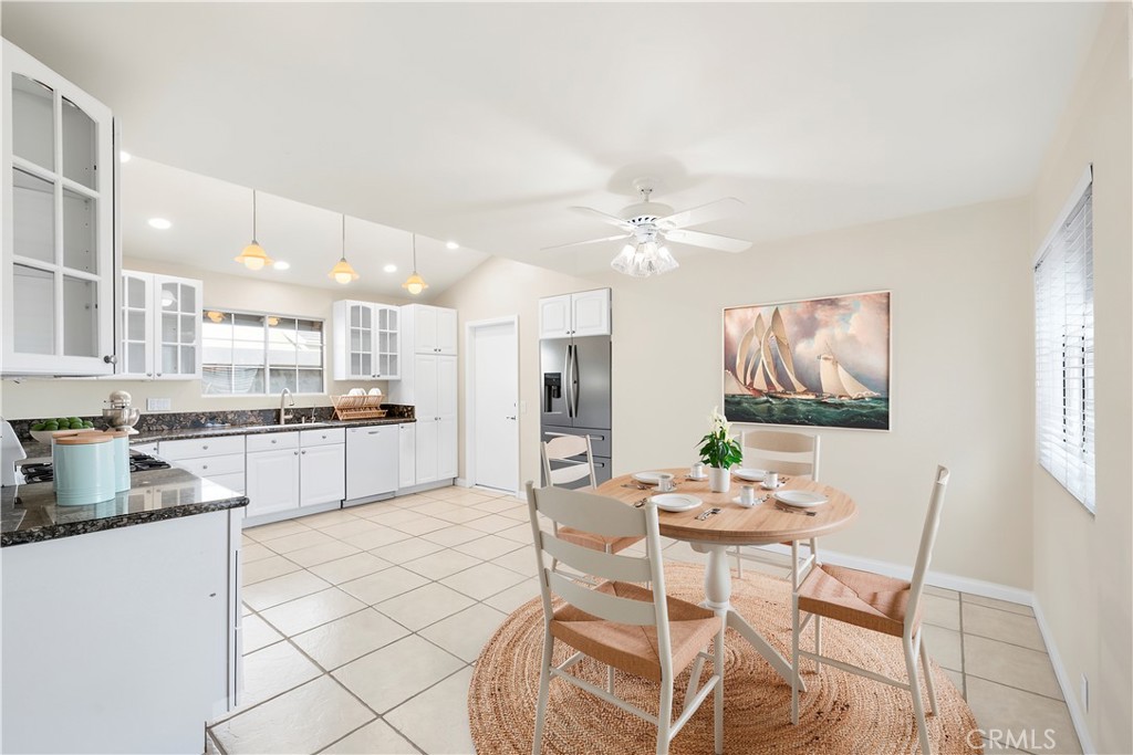 Kitchen with direct access to garage. Dishwasher, microwave and oven/range included in sale. Glass cabinets for an elega - 10212 Valley Forge, Huntington Beach CA 92646 - photo 4