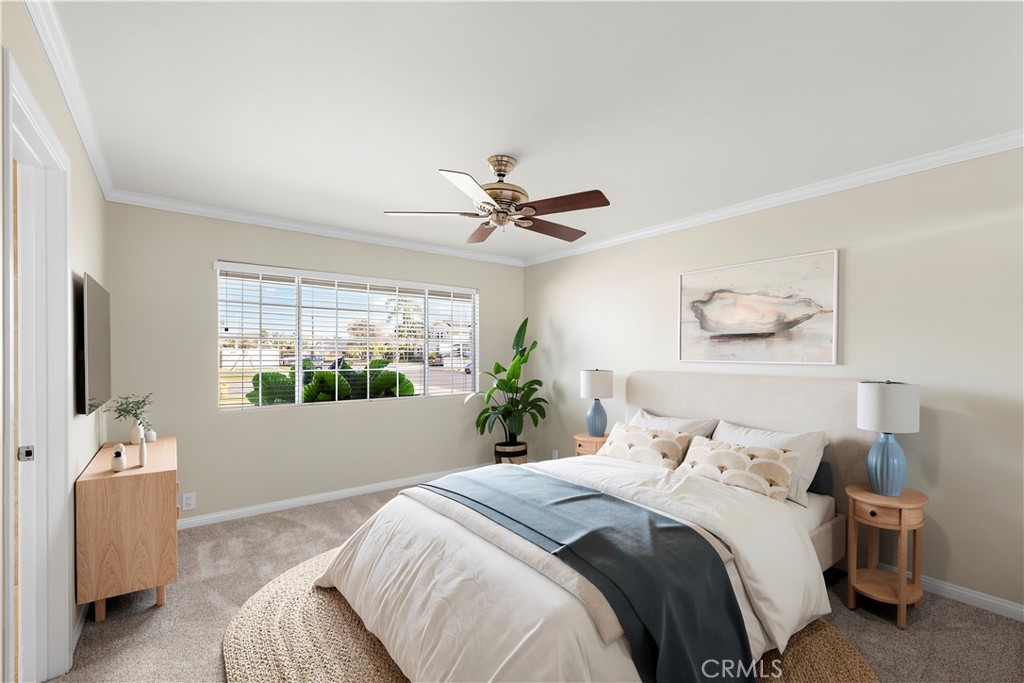 Master bedroom with ensuite bathroom. Ceiling fan. New carpet and freshly painted. Virtually staged. - 10212 Valley Forge, Huntington Beach CA 92646 - photo 5